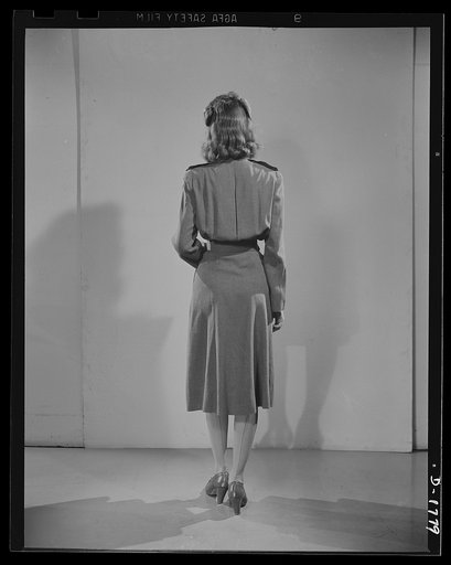 Civilian defense uniforms. Office indoor staff. This girl wears the staff insignia