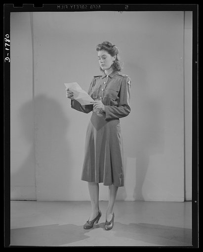 Civilian defense uniforms. Office indoor staff. This girl wears the staff insignia
