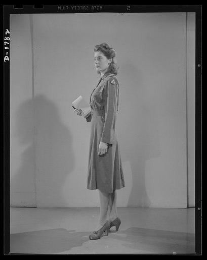 Civilian defense uniforms. Office indoor staff. This girl wears the staff insignia