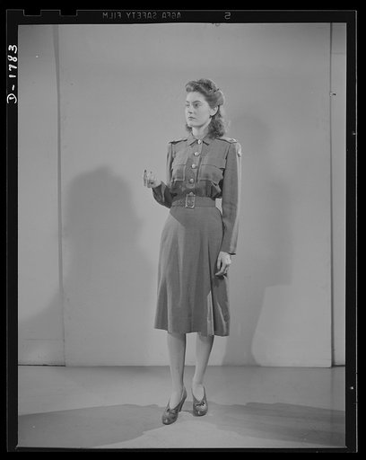 Civilian defense uniforms. Office indoor staff. This girl wears the staff insignia