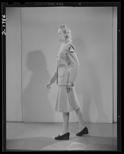 Civilian defense uniforms. Summer "parade." This girl is wearing a messenger's insignia