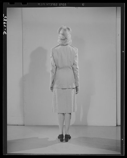 Civilian defense uniforms. Summer "parade." This girl is wearing a messenger's insignia