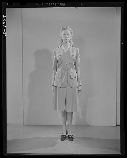 Civilian defense uniforms. Summer "parade." This girl is wearing a messenger's insignia