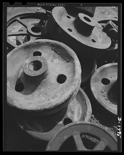 Conservation scrap iron and steel. Industrial scrap is carefully conserved for re-use. These gear blanks are part of the maintenance supplies pile at a large steel plant. They will be used to replace worn parts on rolling mill equipment or possibly remelted with other scrap. Allegheny Ludlum. Bracke