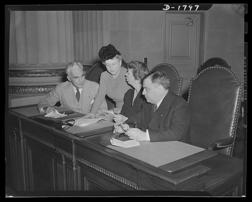 Left to right: Paul V. McNutt, Federal Security Administrator; Miss Elise Davison, Assistant Director in Charge of Volunteer Activities, Women's Division, Office of Civilian Defense; Mrs. Roosevelt, Assistant Director, Office of Civilian Defense; Mayor F.H. LaGuardia, Director of Office of Civilian 