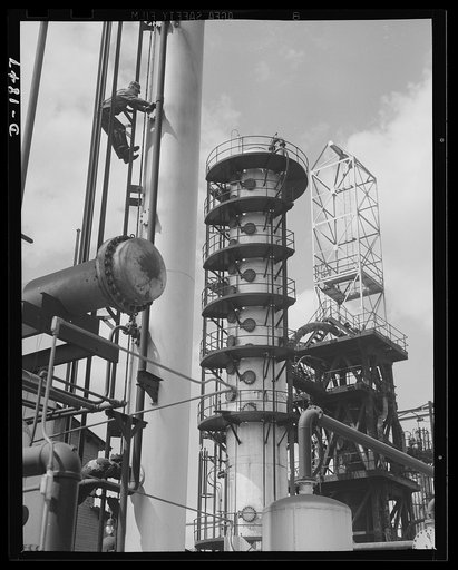 Oil. Oil for our machines of war is supplied by oil refineries like this one. Here are, left to right, the stabilizing, fractionating and heat exchange towers of the McKean cracking plant of the Quaker State Refining Company. Bradford, Pennsylvania
