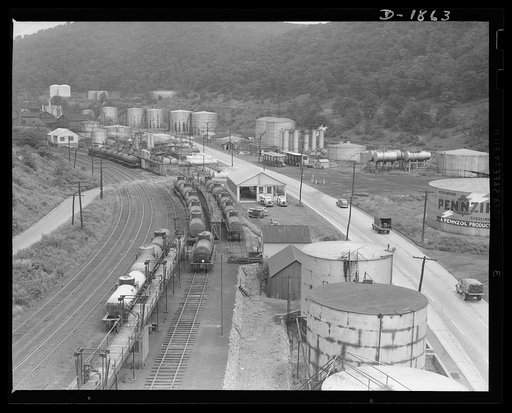 Tanker trains are constantly pulling out from the Quaker State and Pennzoil refineries at Oil City, Pennsylvania, with high-quality lubricants for the fighting men of America to keep the mechanized forces of war in full-time operation