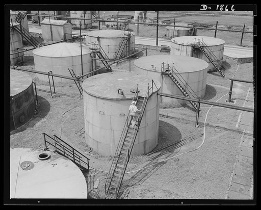 Quaker State Refining Company, Oil City, Pennsylvania. Tanks such as these store the power that moves the huge mechanized armies of today. Many gallons of the high-grade lubricants necessary for tanks, guns and planes are to be found in these tanks