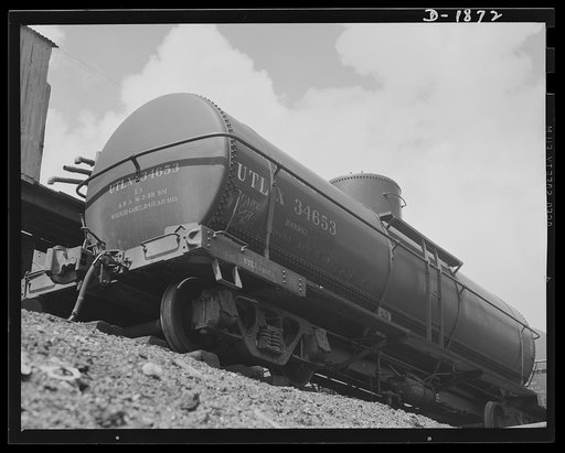 Pennzoil Refinery, Oil City, Pennsylvania. Tank cars such as this are constantly moving in, filling up and moving out again with hundreds of barrels of high-grade lubricants for our military machine, ships and planes
