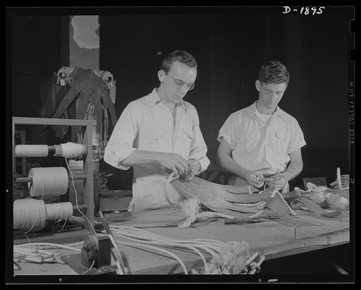 Barrage balloon manufacture. Handling ropes and fingers. Frayed ropes are attached to the rubberized fabric "fingers" by sewing and cementing to give maximum "grip" on the balloon. Such ropes are fastened to the ground cable which controls the height and flight of the balloon. General Tire and Rubbe