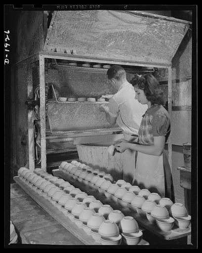 Dipping cups in glaze solution and drying. Shenango Pottery Works, Newcastle, Pennsylvania