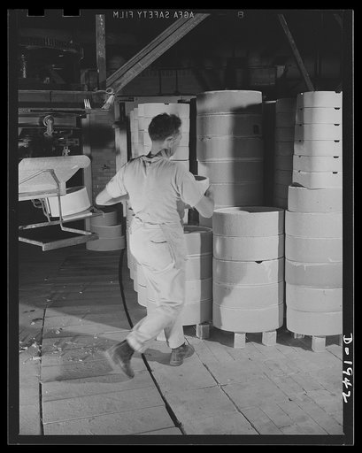 Loading saggers to take ware on tunnel kiln hearth. Shenango Pottery Works, Newcastle, Pennsylvania