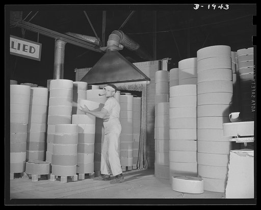 Removing saggers and ware from exit end of tunnel kiln. Shenango Pottery Works, Newcastle, Pennsylvania