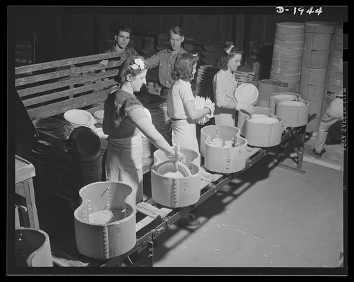 Removing finished ware from saggers. Shenango Pottery Works, Newcastle, Pennsylvania