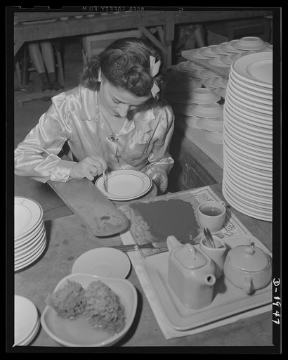 Applying blue bands on china for the wardroom officers mess of the U.S. Navy. Shenango Pottery Works, Newcastle, Pennsylvania