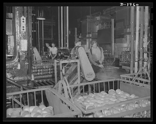 Three-inch A.A. cartridge cases. Cartridge cases for three-inch antiaircraft shells are produced by a series of operations that transform a flat brass disc into a case ready for loading with propelling charge and shell. Between each operation there is careful washing to remove all scale and adhesion