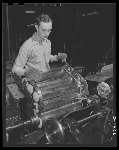 Three-inch A.A. cartridge cases. Cartridge cases for three-inch antiaircraft shells are formed by successive drawing operations, from a flat brass disc into an elongated tubular shape with one rounded closed end. These shapes are trimmed before going on to the heading operation, with the more famili