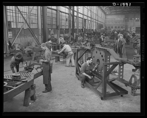 Antiaircraft gun carriage. Thirty-seven millimeter antiaircraft gun carriages come down the assembly line. In the foreground, the frame for the carriage is assembled. War production program scene in a Pennsylvania heavy industry plant now converted to the production of vitally needed military equipm