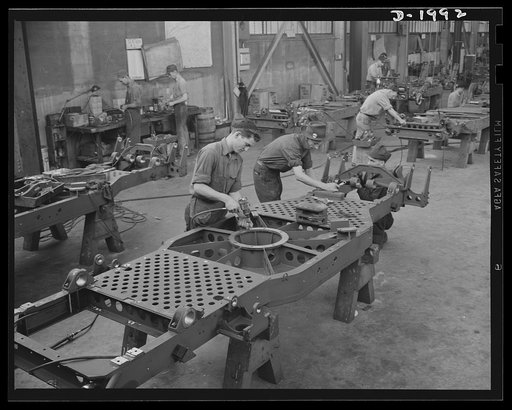 Antiaircraft gun carriage.Thirty-seven millimeter anti-aircraft gun carriages on the assembly line. After the frame has been assembled these workers start to assemble the various parts. Bearing ring for the gun mount, outrigger mountings, etc. War Program production scene in one of Pennsylvania's he