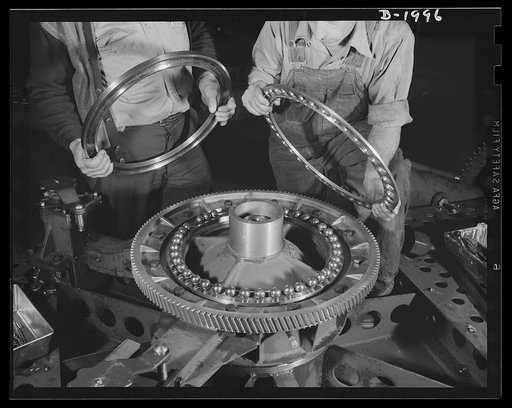 Antiaircraft gun carriage. Assembling the traversing gear and bearing on a thirty-seven millimeter antiaircraft gun carriage. These precision-built ball bearing installations are vitally important, for on their unfailing smooth operation depends the gunners' ability to follow his swiftly moving targ