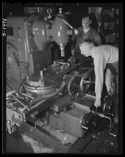 Antiaircraft gun carriage. Axle brackets for a thirty-seven millimeter anti-aircraft gun carriage are machined on this milling machine. Today's fast-moving planes present a target requiring the very best in antiaircraft guns. Carriage and mount are as important as the gun itself for rapid fire power