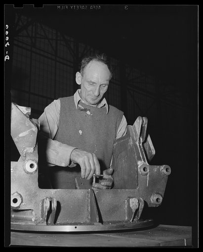 Antiaircraft gun carriage. The top carriage of a thirty-seven millimeter antiaircraft gun carriage receives the final assembly operations. War program production scene in one of Pennsylvania's heavy industry plants now converted to the production of vitally needed military equipment. AETNA. Ellwood 