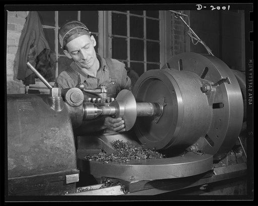 Antiaircraft gun carriage. Machining operation on the hold-down clamp for a thirty-seven millimeter antiaircraft gun carriage. War program production scene in one of Pennsylvania's heavy industry plants now converted to the production of vitally needed military equipment. AETNA. Ellwood CIty, Pennsy