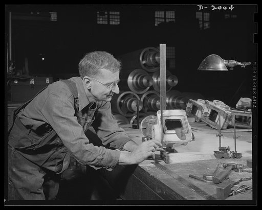 Antiaircraft gun carriage.  This master machinist lays out the precision parts that go to make up a thirty-seven millimeter anti-aircraft gun carriage. Swift flying planes present a difficult target, the anti-aircraft gun must be a precision instrument. War program production scene in one of Pennsyl