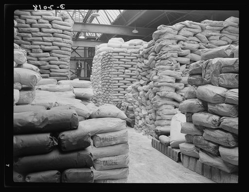 Piles of bagged compound ingredients. Tire ingredients which are drawn from this reserve pile for each new set of "batches" include these bags of calcene, carbon black, zinc oxide and various other ingredients. General Tires