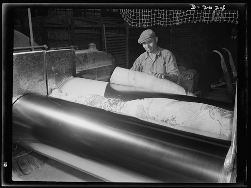 The art of mixing and milling requires skillful judgement and deftness of hand. Part of the secret of these tires lies in the careful training and supervision of these skilled workers. Rubber is flopped and turned over and over again, slashed and bunched in some sports, permitted to run thin in othe