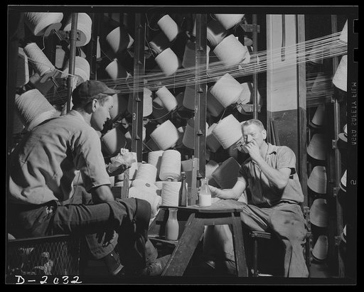 Lunch on the job. Lunchtime in the creel room does not release workers from watching the flow of the cord. Whereas there is not often an emergency break, someone must be on hand in case the emergency should arise. Firestone (General Tires), Akron, Ohio