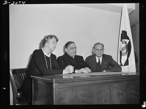 Director F.H. LaGuardia (center) and Mrs. Eleanor Roosevelt, assistant director of the Office of Civilian Defense with Dean James M. Landis (right) of the Harvard Law School on the occasion of his arrival in Washington to assume his new duties as executive in the Office of Civilian Defense