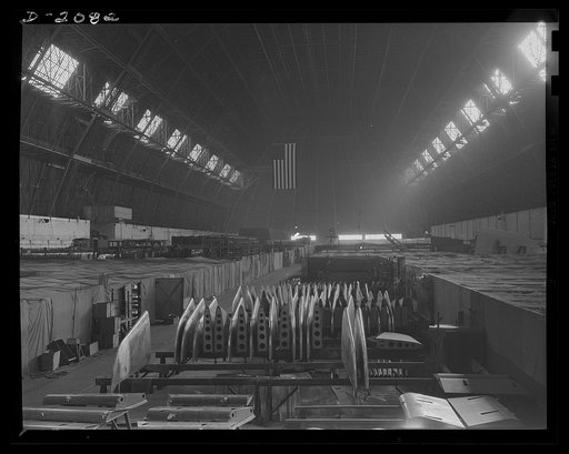 Subcontracting aircraft parts. The entire floor space of this huge Ohio plant is devoted to the manufacture of airplane parts. Working areas are covered with canvas so that they may be individually heated. It is not possible to heat the entire air volume of the building, which approximates 45,000,00