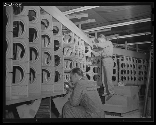 Subcontracting aircraft parts. When completed, this maze of metal parts will be the stabilizer for a giant patrol plane designed for use by the U.S. Navy. Parts for numerous warplanes are made at this huge plant in Ohio. Goodyear, Akron, Ohio