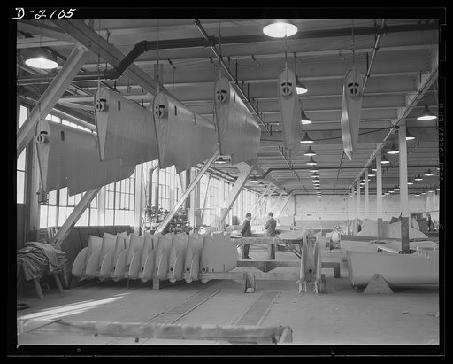 Subcontracting aircraft parts. Here is the "dope room" at a huge Ohio plant. The fabric covering control surfaces for military aircraft is here doped, or covered with protective paints. Goodyear, Akron, Ohio