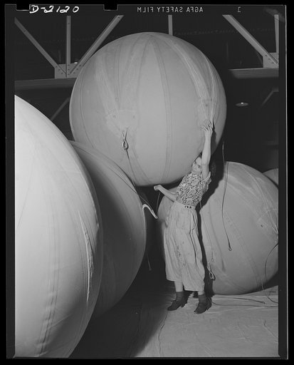Flotation bag manufacturing. Spherical flotation bag used in a famous American bombing plane for protection in event of crash landing at sea. Bags are carried, deflated, in wings and fuselage and may be inflated almost instantly with compressed air contained in cylinders. Goodyear, Akron, Ohio
