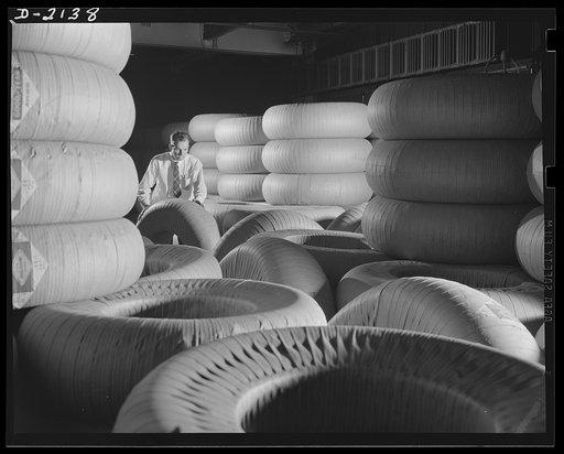 Military tire manufacture. Huge truck tire like those shown in this tire storeroom are playing important part in the nation's war effort. Tires like these are used on huge trucks and military prime movers. Goodyear, Akron, Ohio