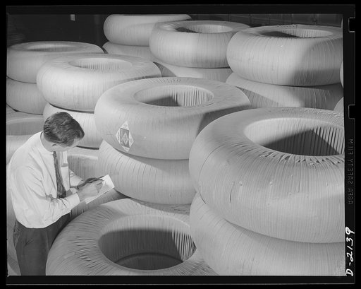 Military tire manufacture. Huge truck tire like those shown in this tire storeroom are playing important part in the nation's war effort. Tires like these are used on huge trucks and military prime movers. Goodyear, Akron, Ohio
