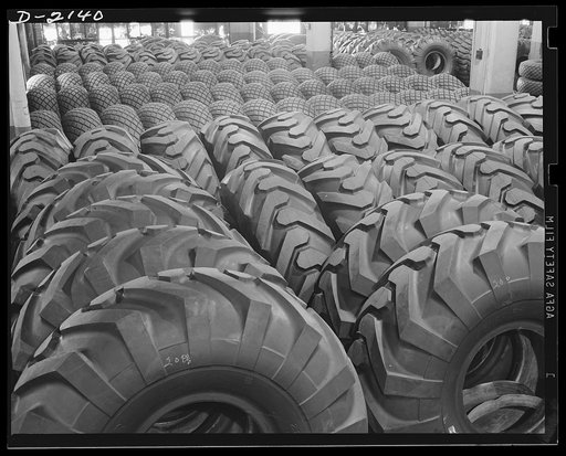 Giant tire manufacturing. Construction of modern airports and other military facilities which requires moving large quantities of earth necessitates equipment identified as earth movers. Earth movers use huge rubber tires like these, some of which cost as much as $2,500  each. Goodyear, Akron, Ohio