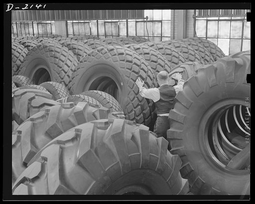 Giant tire manufacturing. Construction of modern airports and other military facilities which requires moving large quantities of earth necessitates equipment identified as earth movers. Earth movers use huge rubber tires like these, some of which cost as much as $2,500 each. Goodyear, Akron, Ohio