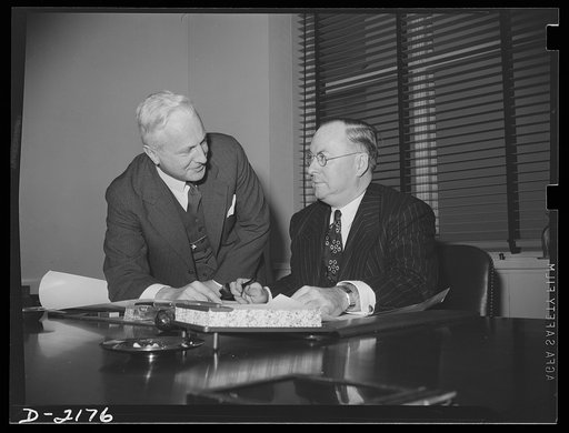 W. H. Harrison (left), Director, Production Division, War Production Board and Donald M. Nelson, Chairman, War Production Board