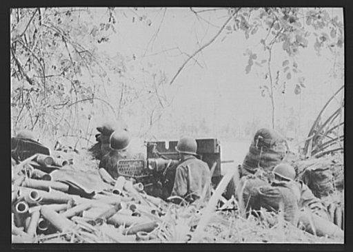 U.S. forces inflict heavy casualties on Japs in capture of Buna, New Guinea. A 37 mm. gun crew, part of a U.S. Army tank force in New Guinea, fires at an objective at Buna Mission. Empty shells, heaped hurriedly in the foreground, indicate intensity of fire. The action resulted in the complete rout 