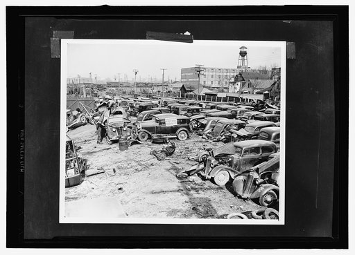 Auto graveyard. A Detroit auto graveyard. Junked autos and trucks to be shipped to scrapyards and then to the Great Lakes Steel Plant