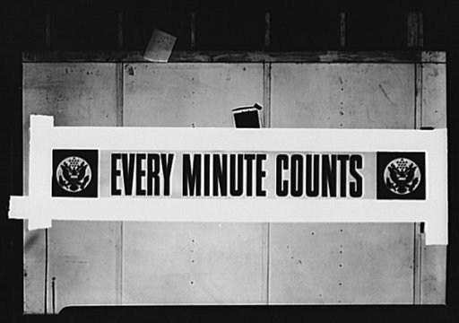 Every minute counts. A three-color (red, white and blue) poster designed and produced by the Division of Information, Office of War Information (OWI), for display in war plants throughout the nation