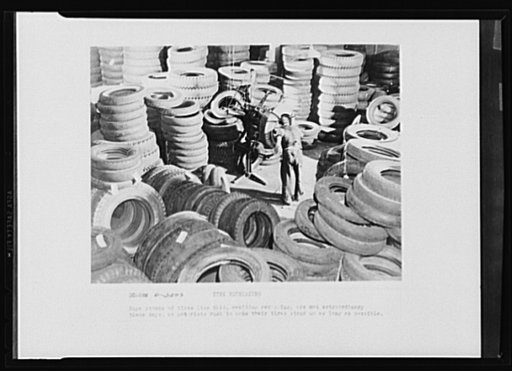 Tire retreading. Huge stacks of tires like this, awaiting recapping, are not extraordinary these days as motorists rush to make their tires stand up as long as possible