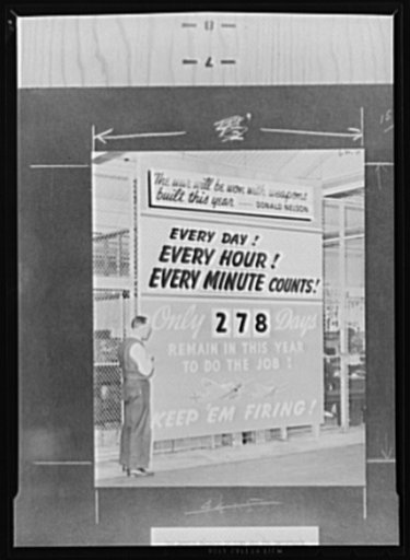 War production drive poster. The terrible urgency of time in war production is emphasized by this display in the Oldsmobile plant, where an effective labor-management committee is conducting a war production drive