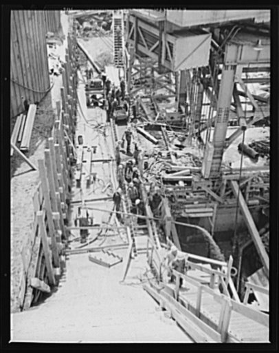 Tennessee Valley Authority power and conservation. Fort Loudoun Dam construction. A busy construction scene near the downstream face of the new Fort Loudoun Dam, furthest upstream of the TVA's main Tennessee River projects. Scheduled for closure and first storage of water early in 1943, this dam wil