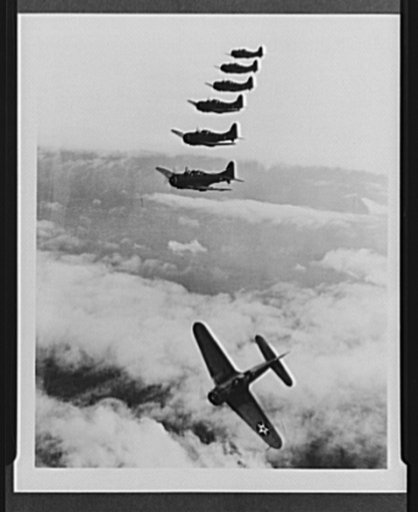 Navy aircraft. Douglas dauntless dive bomber. Dive bomber peeling off for attack