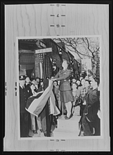 War production drive. As part of the war production drive, streets at the Bloomfield, New Jersey Westinghouse plant were renamed MacArthur Avenue and MacArthur Plaza. A pretty girl is shown unveiling the street sign