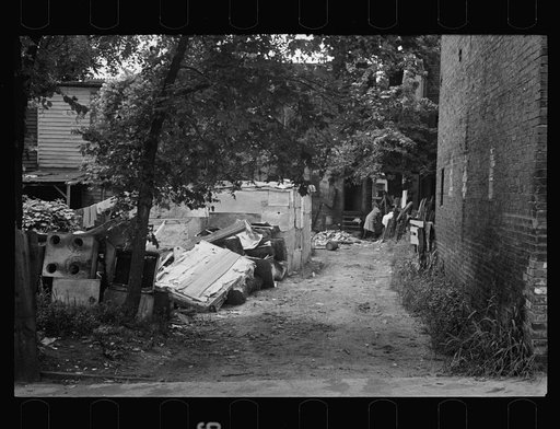 Untitled photo, possibly related to: Negro backyard near Capitol, Washington, D.C. Negro children have just discovered the cameraman and are concerned at his presence